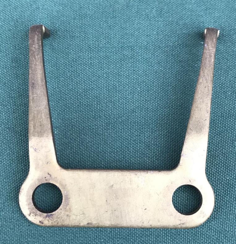 Handbrake caliper retraction fork plate